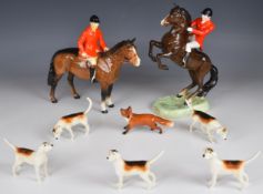 Beswick hunting group of standing and rearing huntsmen, five hounds and a fox, tallest 24cm