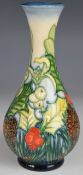 Moorcroft limited edition 101/150 pedestal vase, decorated in the Holly and Mistletoe pattern, dated