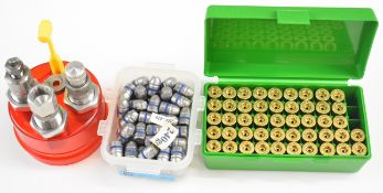 A collection of .44 Smith & Wesson cartridge re-loading items including dies, bullet heads, brass