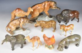 Ten Beswick / Royal Doulton wild animals including two different cougar on rock examples, tallest