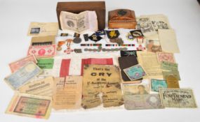 WW2 German ephemera including propaganda leaflets, medal bars, dog tags, Red Cross proficiency