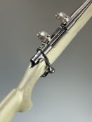 Howa Model 1500 6.5x55 bolt-action rifle with composite stock, textured semi-pistol grip and forend,