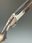 Browning B325 12 bore over and under ejector shotgun with engraved scenes of birds to the locks,