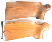Two BSA Martini International rifle stocks, both with semi-pistol grips, one with adjustable butt
