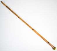 English blowpipe walking stick with Masonic enamel crest to the brass mouthpiece and a bamboo shaft,