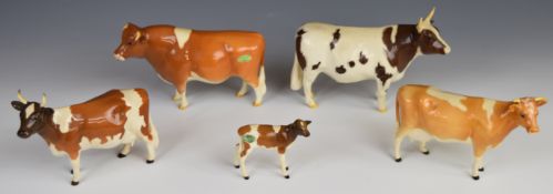Beswick Ayrshire and Guernsey bull, cow and calf figures, tallest 12cm