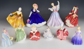 Ten Royal Doulton figurines including Figure Of The Year May, June, Top O' The Hill etc, tallest