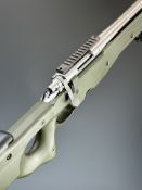 Remington Model 700 .308 bolt-action rifle with composite Accuracy International stock, thumb-hole
