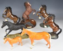 Seven Beswick / Royal Doulton horses including Black Bess, Spirit Of The Wild etc, tallest 28cm