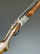 Dan Arms 12 bore over and under ejector shotgun with named action, chequered semi-pistol grip and