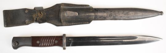 German WW2 K98 bayonet with Bakelite grips and fullered blade, marked ab44, in metal scabbard with