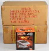 Twelve Daisy Porta Guard 270S solar charged infrared security alarms, all sealed in original boxes