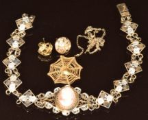 A silver filigree bracelet set with a cameo, 9ct gold spider web pendant (damaged), gold plated