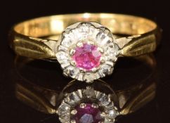 An 18ct gold ring set with a ruby surrounded by diamonds, 2.4g, size `M