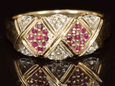 A 9ct gold ring set with rubies and diamonds in a diamond shaped design, 4g, size N