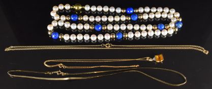 A 10k gold pendant set with a citrine and diamonds on 9ct gold chain, a 9ct gold ribbon necklace (