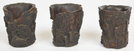 Three 18th / 19thC Chinese carved wooden wine cups / brush washers with figural and prunus blossom
