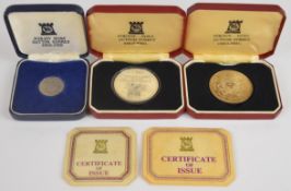 Pobjoy Mint 1976 Montreal Olympics 950/1000 7.96 platinum medal, together with two Pobjoy Mint