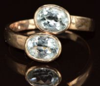 A 9ct gold ring set with two oval cut aquamarine, 4g, size Q