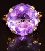 A 9ct gold ring set with a round cut amethyst, 5.6g, size M