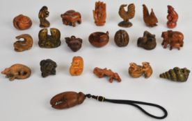 Twenty one carved boxwood style and similar netsukes, all in the form of animals, tallest 6cm
