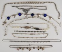 Eight silver necklaces including one made up of spherical links, pearl, dolphin, three marcasite,