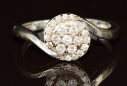 A 9ct gold ring set with diamonds in a floral twist setting, 2.3g, size K