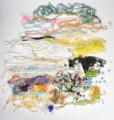 A collection of beads including pearls, agate, peridot, citrine, amethyst, garnet, black spinel,