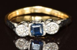 An 18ct gold ring set with a square cut sapphire and diamonds in a platinum setting, 2.3g, size N