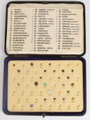 Cased set of precious stones including garnets, lilac sapphire of approximately 2.4ct, pale blue