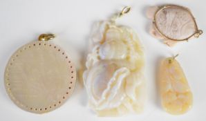 Four Chinese pendants comprising three carved from opal (largest 58mm long) and one made using