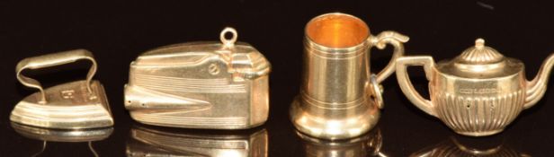 Four 9ct gold charms in the form of a lighter, tankard, kettle and iron, 5.6g