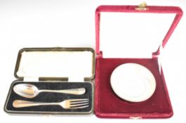 Two 800 grade silver bowls, diameter 9.5cm, weight 60g, and a cased hallmarked silver fork and spoon