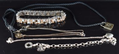 Two Tiffany & Co silver pendants, one in the form of a key and the other an initial 'J', a Tiffany &