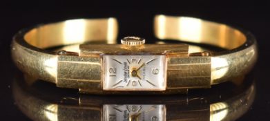 Leuba Louis 18ct gold ladies bangle wristwatch with gold hands and hour markers, silver dial and