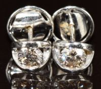 A pair of 18ct white gold earrings each set with a round cut diamond of approximately 0.35ct, 2.5g