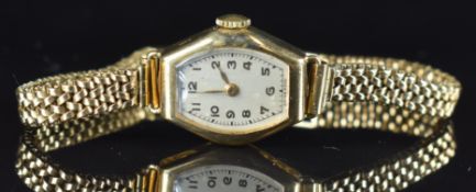 Pinnacle 9ct gold ladies wristwatch with gold hands and Arabic numerals, silver dial and signed 15