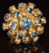 A yellow metal ring (tests as 18k) set with round paste in a domed setting, 4.8g, size M