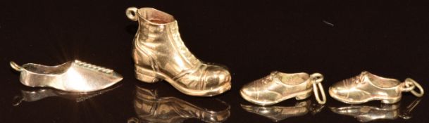 Three 9ct gold charms, all in the form of shoes, 5.1g