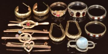 Two pairs of 9ct gold earrings (2.4g), four 9ct gold brooches (damaged and soldered), three silver