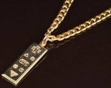 A 9ct gold Millennium ingot pendant with feature hallmarks (3.4cm) on 9ct gold curb link necklace,