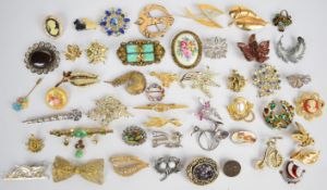 A collection of vintage brooches including two filigree, two silver, Czech, Capri, Norwegian
