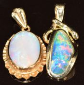 A 14k gold pendant set with a black opal doublet (2.4g, 2.6cm) and a 9ct gold pendant set with an