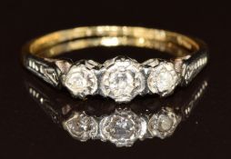 An 18ct gold ring set with three diamonds in platinum setting, 2.6g, size R