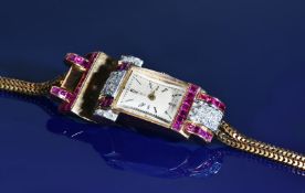 Art Deco 18ct gold ladies wristwatch set with calibre cut rubies and diamonds to the case and with