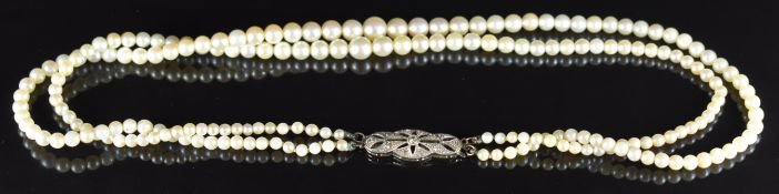 A double strand cultured pearl necklace, the white gold clasp set with diamonds, 23.3g, 38 & 44cm