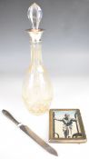 Hallmarked silver mounted cut glass decanter, hallmarked silver handled bread or similar knife and a