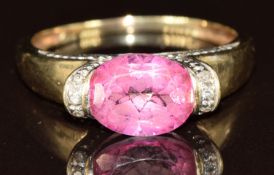 A 9ct gold ring set with an oval cut synthetic pink spinel and diamonds, 2.4g, size Q