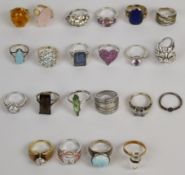 Twenty two silver rings including pressed amber, cubic zirconia, rose quartz, labradorite, lapis