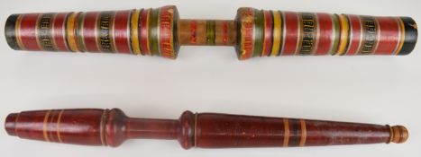 Indian double ended multicoloured spice pestle and another similar implement, longest 64cm
